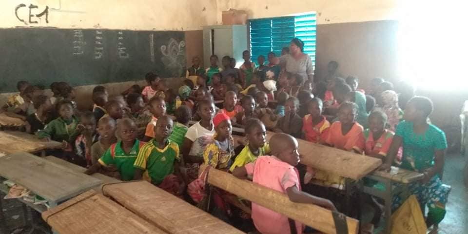 Distribution of scholarships to children in Burkina Faso